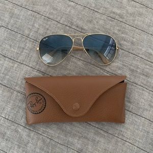 Ray-Ban classic Aviator Gradient Sunglasses with Gold Frame and Blue Lens.